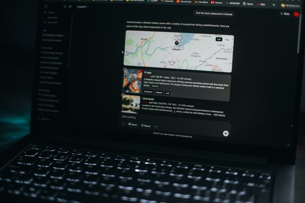 A laptop screen displays a dark-themed web page with a map and information about restaurants in Geneva, reflecting how LLMs are transforming search for international markets.
