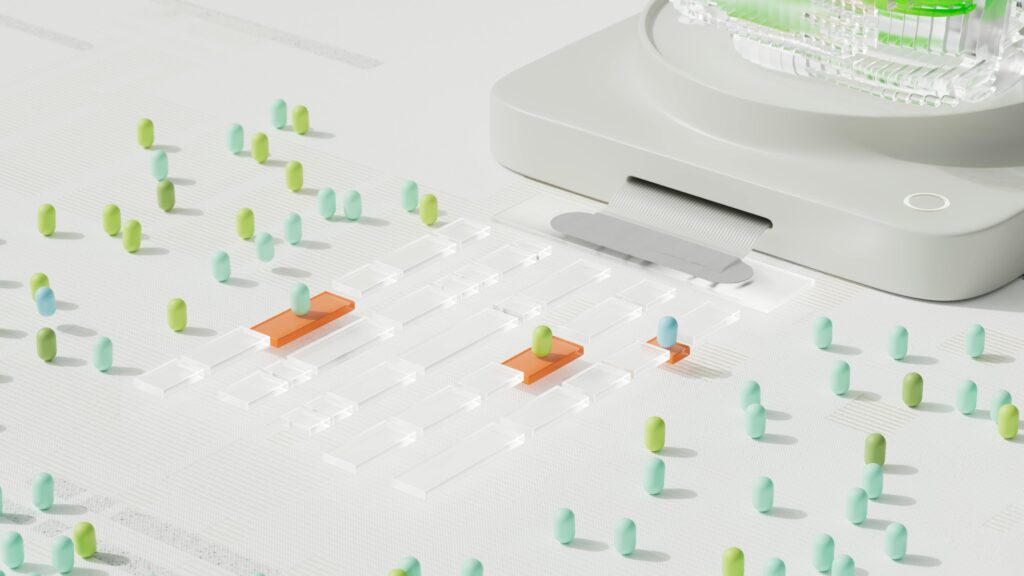 A device dispenses colored capsule-shaped objects onto a grid of transparent and orange rectangles, resembling how structured data or schema markup organizes information for better SEO, with more capsules scattered across a white surface.