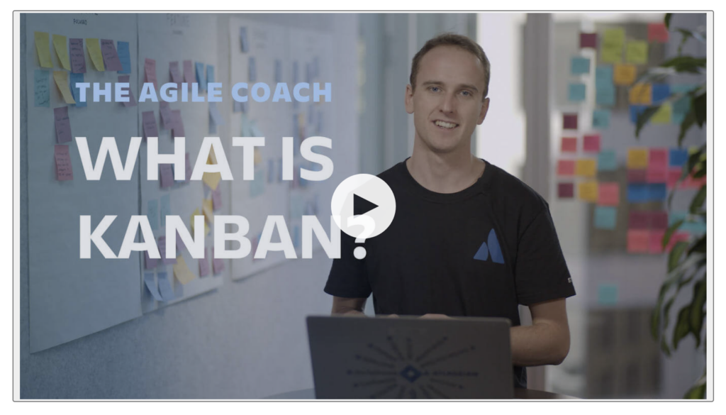 A person sits at a desk with a laptop, in front of a wall covered in sticky notes. Text on screen reads "The Agile Coach: What is Kanban?"—exploring how AI can optimize Content Formats within Agile teams.