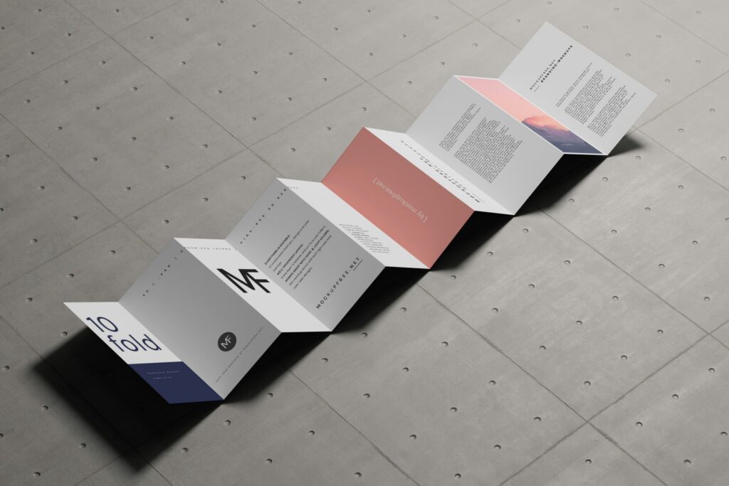 Accordion-style folded product catalog with a modern design, featuring minimal text, graphics, and pastel color blocks, displayed on a gray tiled surface.